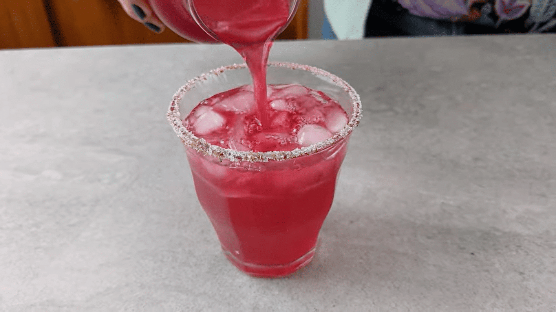 adding ice and cumin salt to serve it for pomegranate lemonade