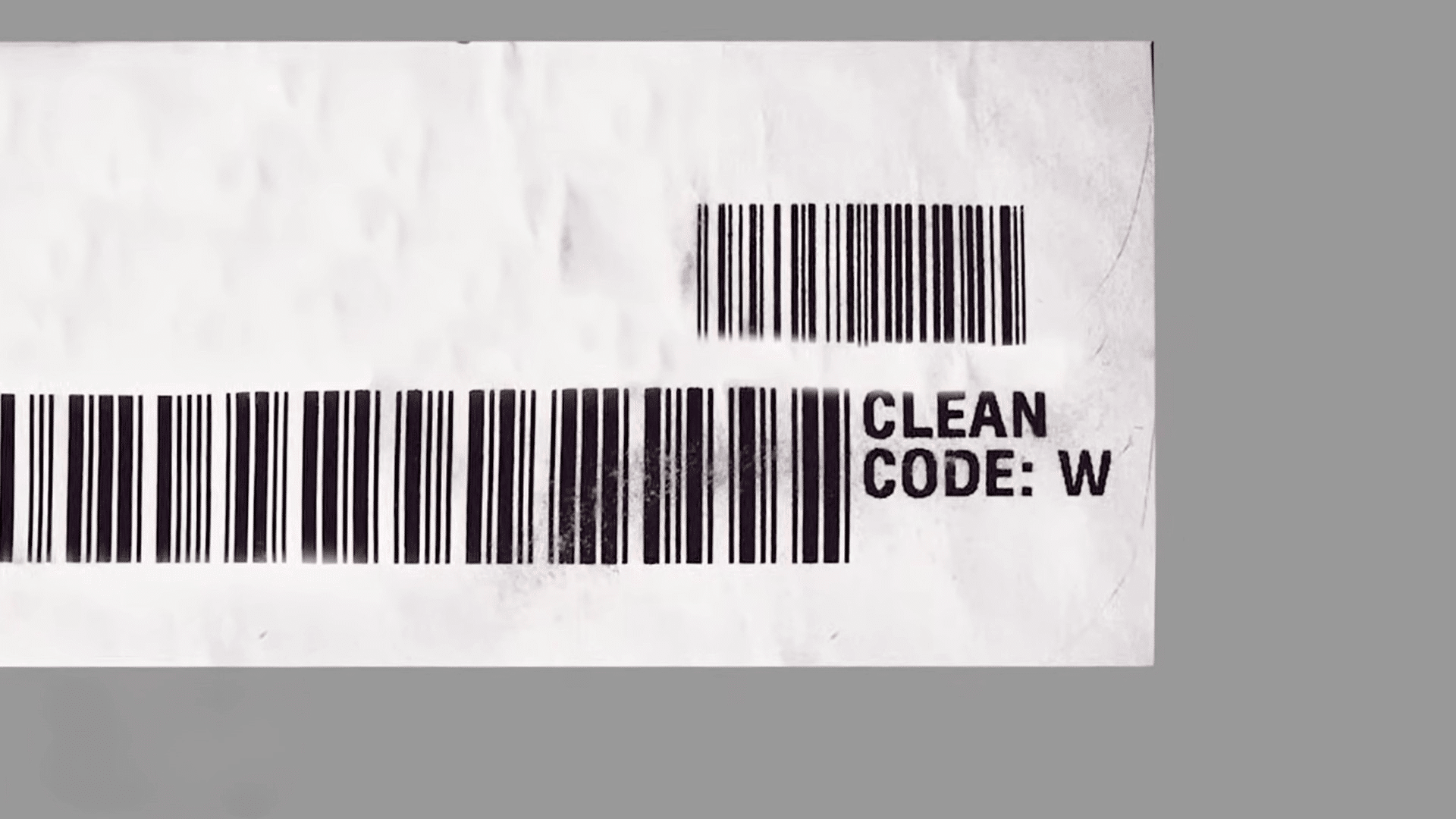 barcode label with clean code text printed on white paper and orange step 1 box on gray background