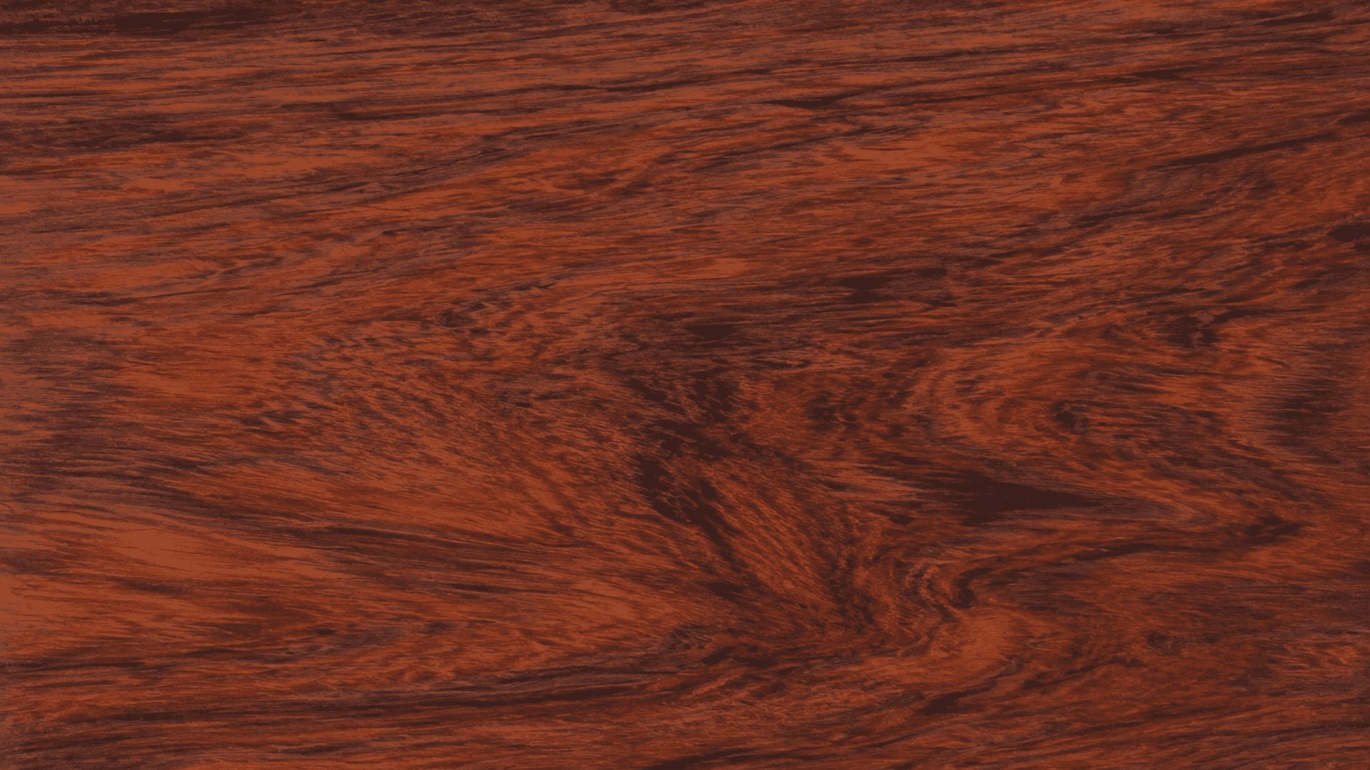 dark reddish wood texture with rich flowing grain patterns across a smooth polished natural wooden surface