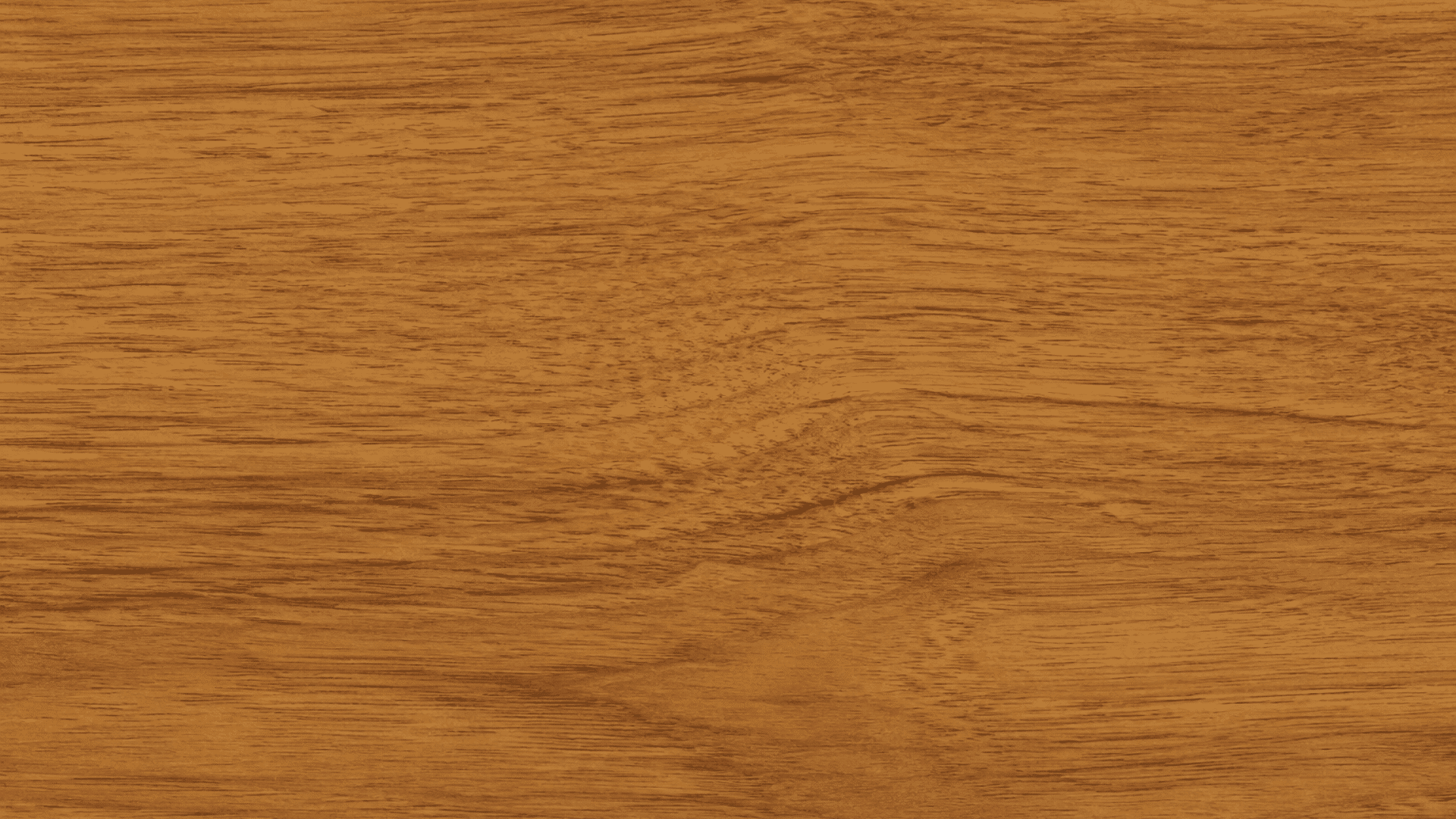 golden brown wood texture with subtle flowing grain patterns spread evenly across a smooth polished surface