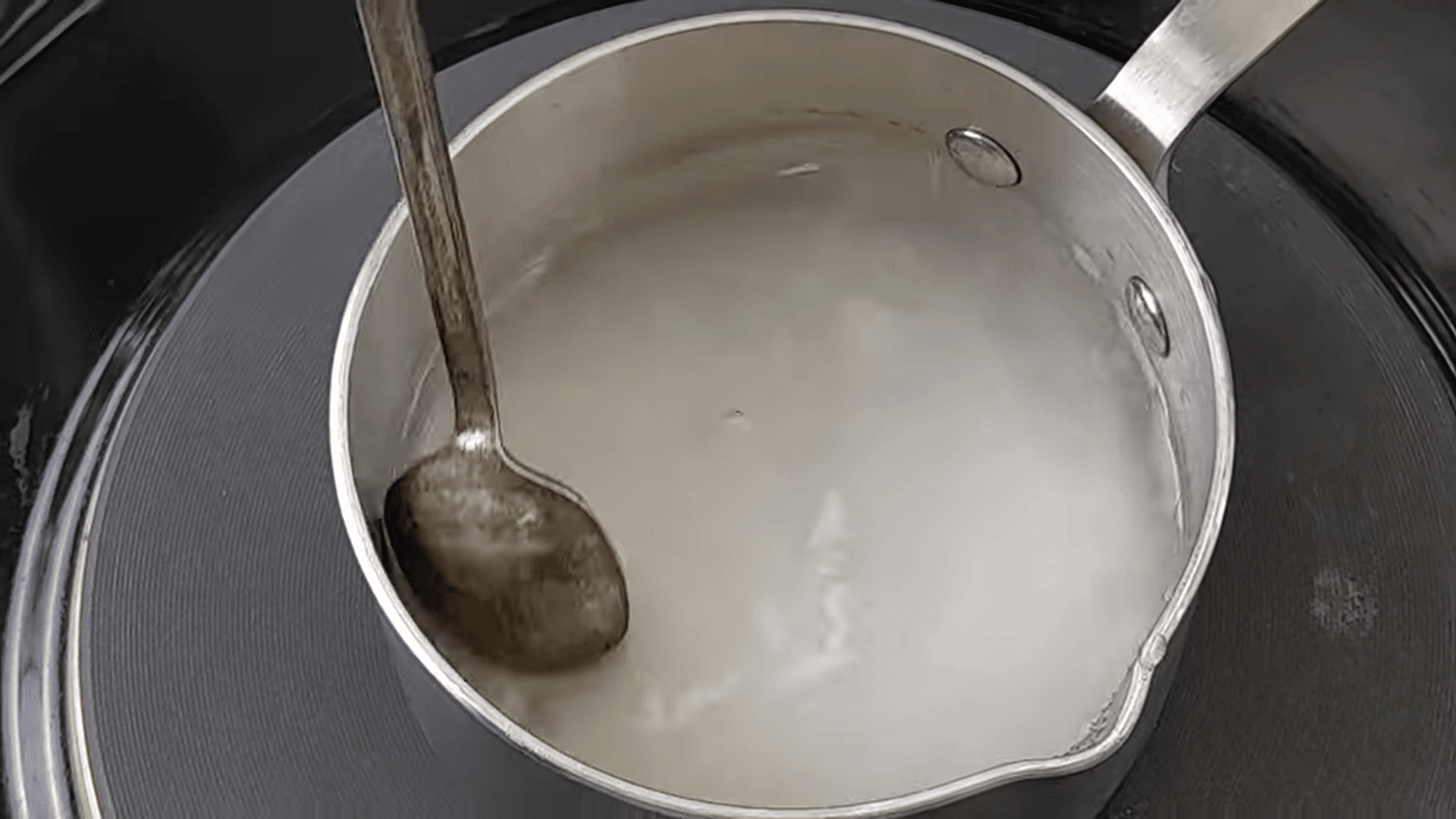 mixing the sugar syrup for pomegranate lemonade