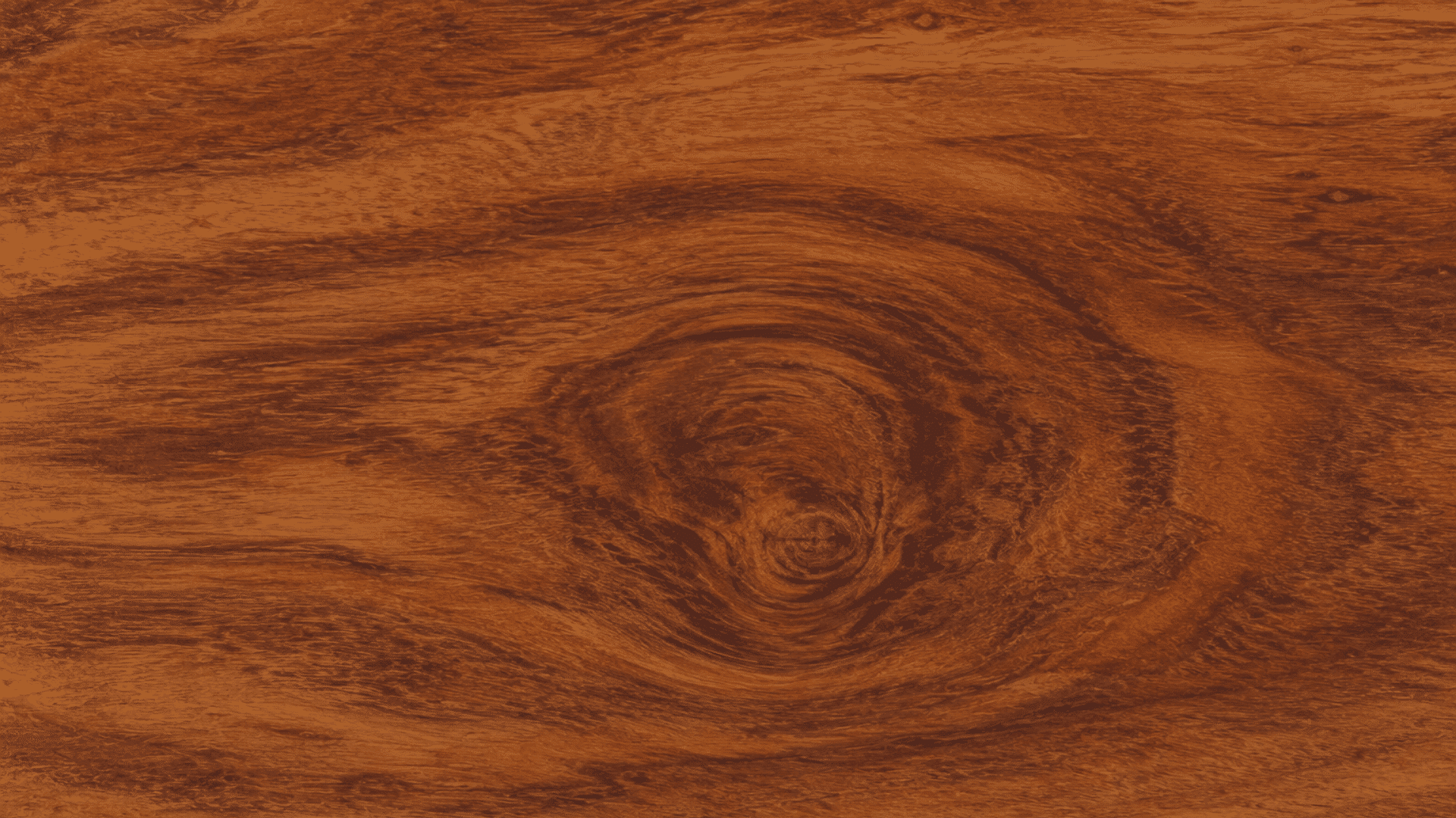 rich brown wood texture with swirling natural grain patterns and a large circular knot at the center area