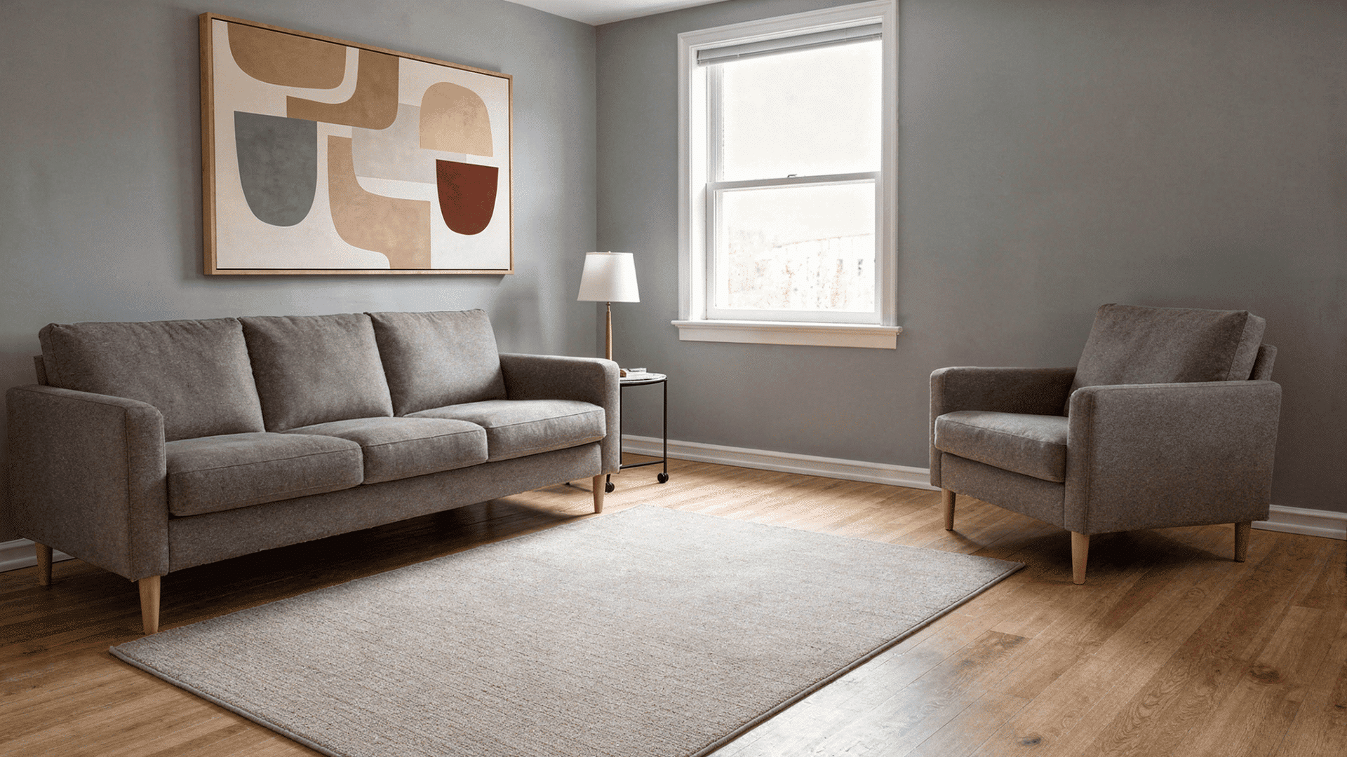 lagom living room with balanced seating and reading zones separated by open floor space