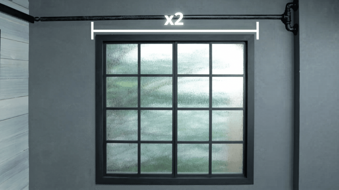 window with curtain rod and marked width measurement showing doubled span for fuller curtain coverage